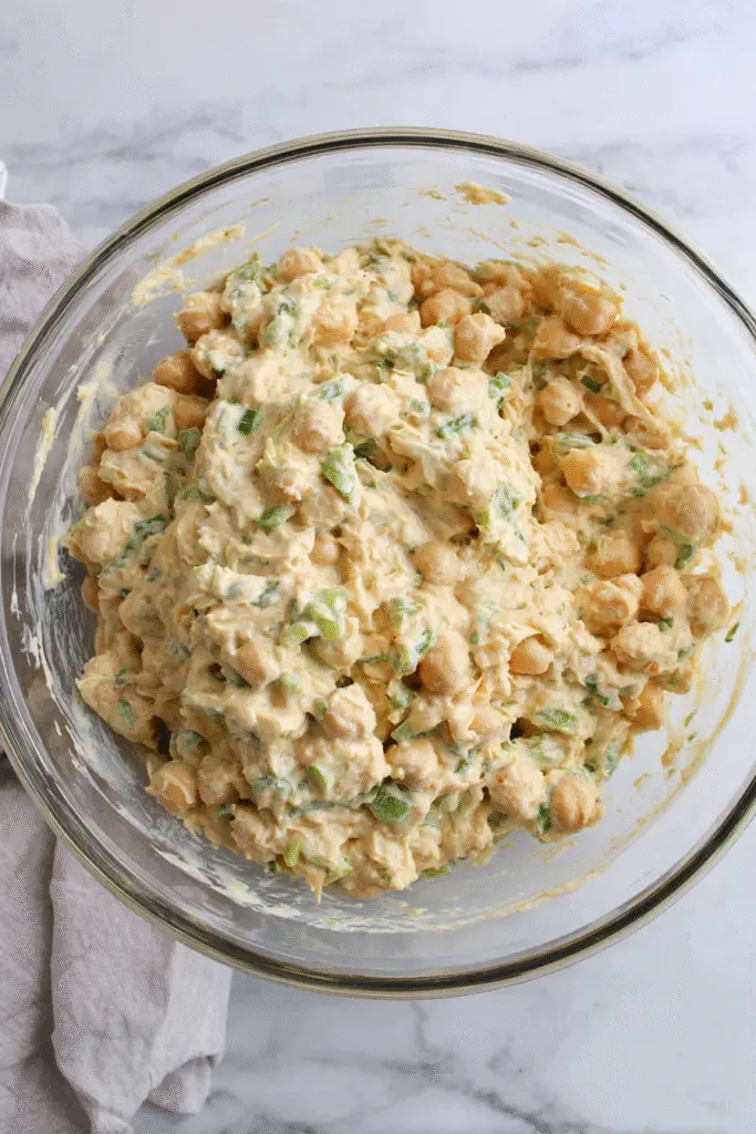 Making chickpea salad sandwich